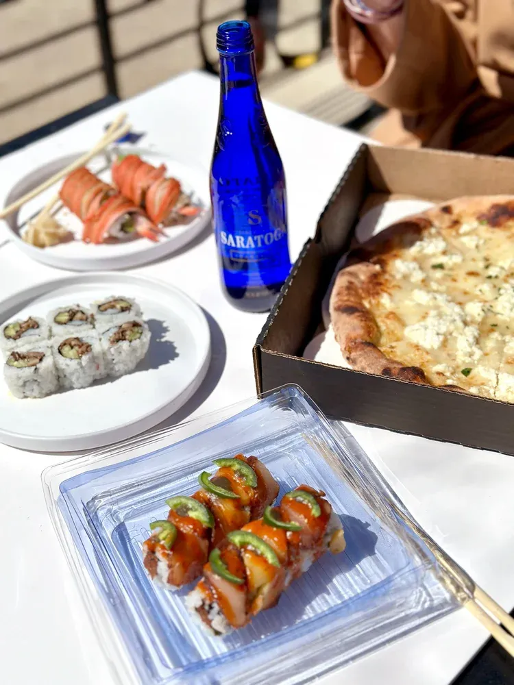 Pizza and sushi catering spread from Pizzeria Maki, Wilmington Delaware